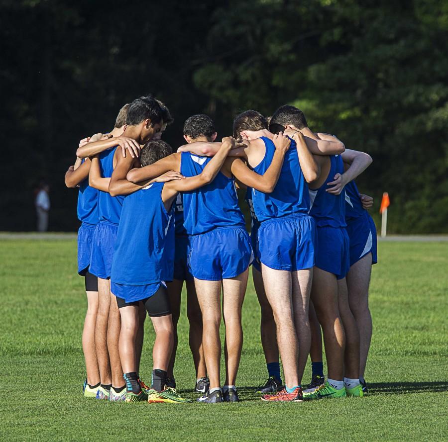 The “Varsity 10” huddles up before their 4k run on Sept. 24 at Bethpage State Park. The Vikings won the meet and remain undefeated so far this season.