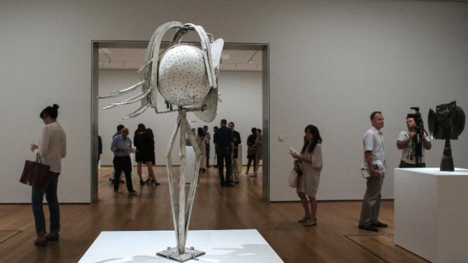 Viewers enjoy one of over 100 sculptures at the new Picasso Sculpture exhibition at the Museum of Modern Art. The sculptures vary in size, shape, and content. This is the first exhibit to feature Picasso’s sculptures in the U.S. in 50 years. 