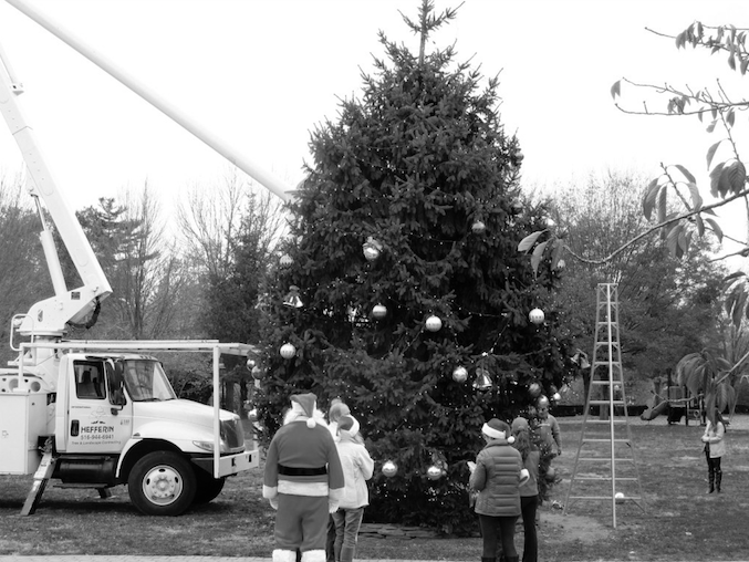 The Christmas tree had to be put up and decorated in preparation for the event. Hundreds of community members gathered to participate in holiday activities and witness the lighting of the tree on Dec. 4.