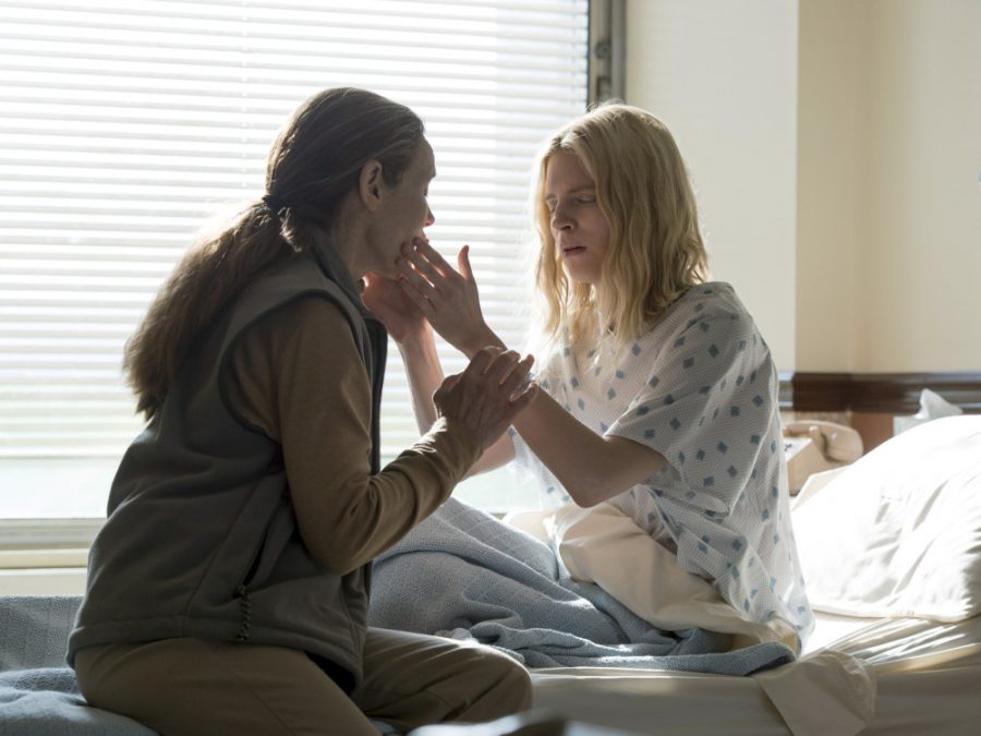 The main character of The OA, Praire Johnson (Brit Marling) is blind, and feels the face of a friend.