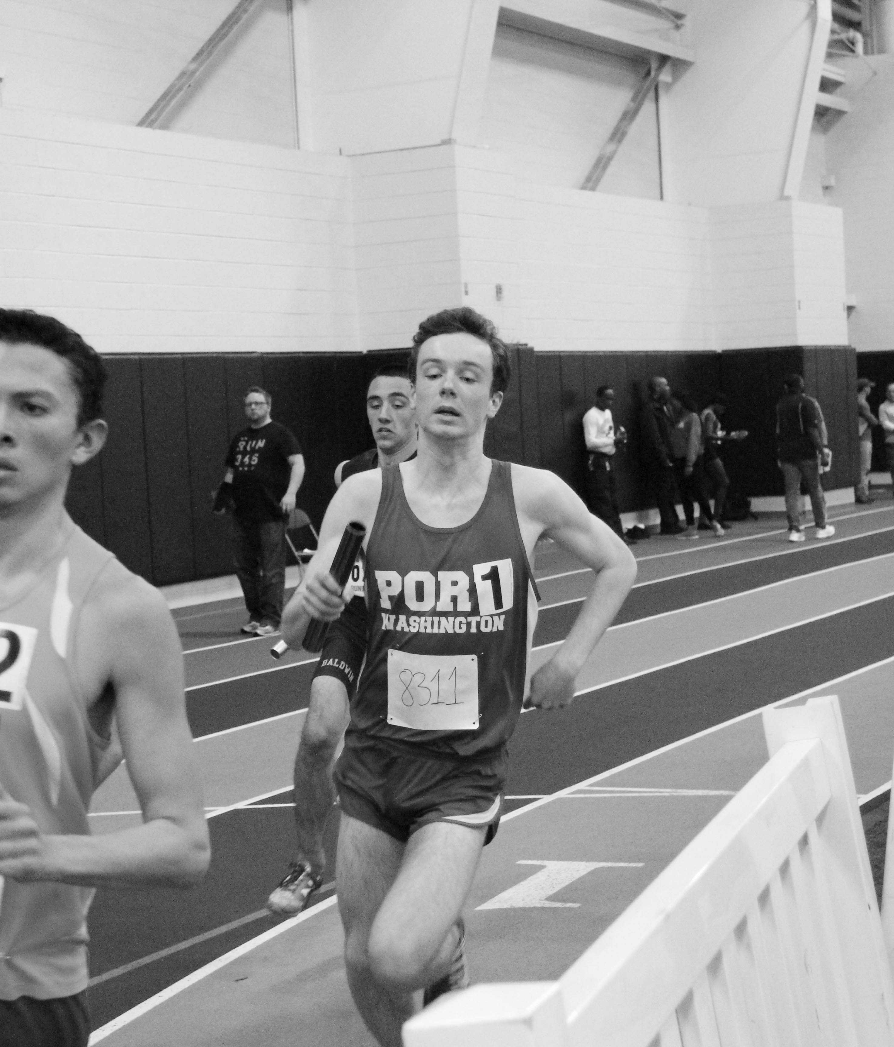 Senior Rory Owens runs alongside his competitors at their meet at St. Anthony's on Feb. 8.