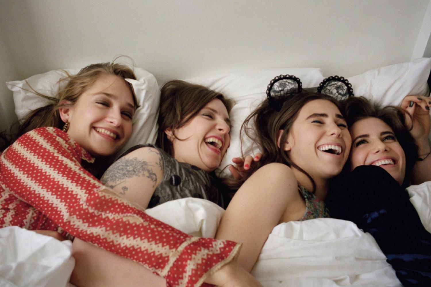 Jessa (Jemima Kirke), Hannah (Lena Dunham), Shoshanna (Zosia Mamet), and Marnie (Allison Williams) share a laugh in a moment of HBOs Girls.