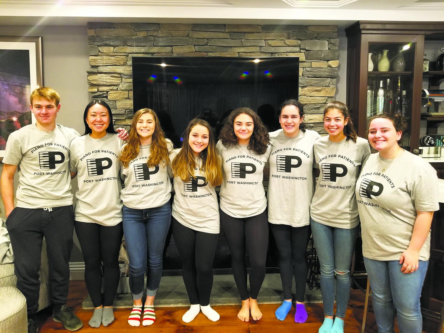 The Port Washington Chapter of Piano for Patients members AJ Siciliano, Sherry Shi, Valentina Scotto, Sarabeth Schiff, Emma Klein, Emma Goldman, Sofia Kuusisto, and Eden Franco. The group performed their instruments once a month for the Sands Point Center for Health and Rehabilitation.