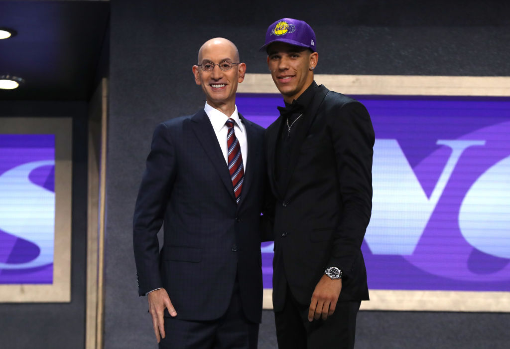 Laker's point guard poses with commissioner Adam Silver after being selected with the second overall pick in the 2017 NBA draft.