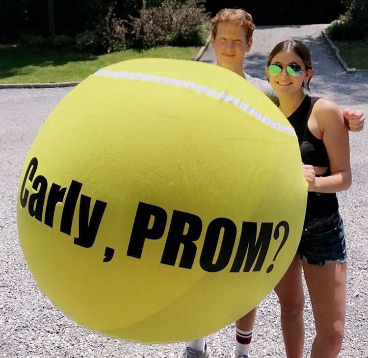 Schreiber+Alum+Austin+Egna+asked+junior+Carly+Hecht+to+prom+last+spring.+He+stood+outside+her+house+with+a+big+tennis+ball+that+said+Carly%2C+PROM%3F