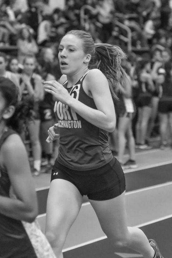 Bazzini races the 600m dash at a league meet at St. Anthonys High School on Dec. 20.