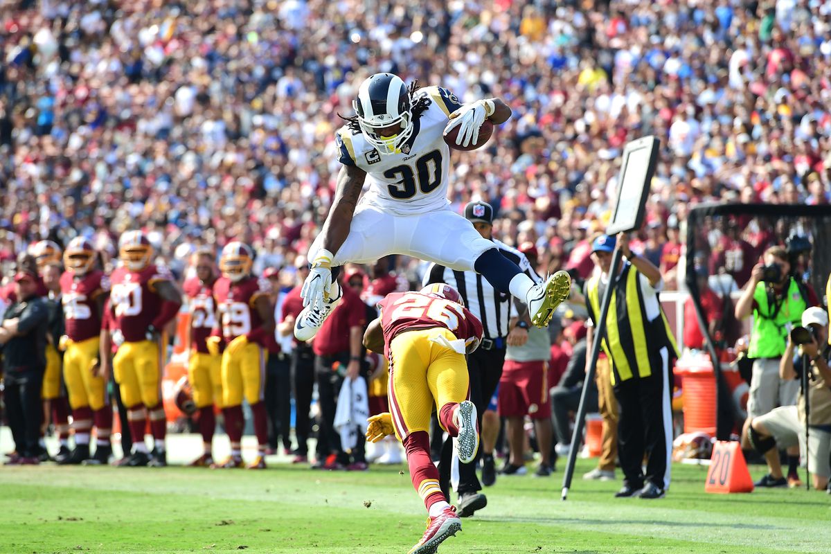 Todd Gurley, a popular first overall pick, hurdles Bashaud Breeland. The Rams lost that game 20-27 to the Redskins.