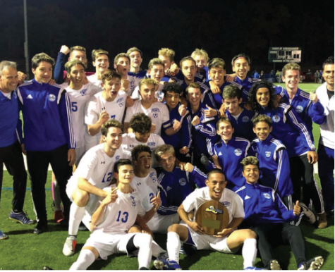 The squad celebrates after winning the Long Island Championship against Walt Whitman with a score of 2-1.