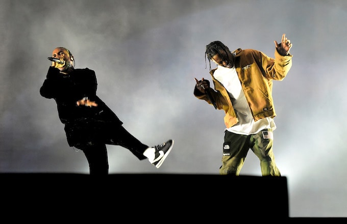 Singer Travis Scott surprises thousands of fans by performing Birds in the Trap Sing McKnight with raper Kendrick Lamar at Madison Square Garden.