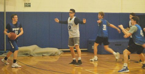 Senior Marc Daly looks to move the ball around junior Matthew Schmitz during a scrimmage on Jan. 10.