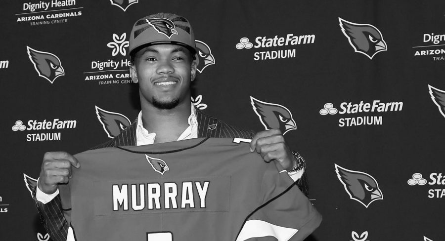 Kylar Murray holds his new jersey after being selected number one overall by the Arizona Cardinals.