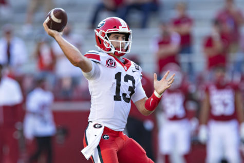 FAYETTEVILLE, AR - SEPTEMBER 26:   Stetson Bennett #13 of the Georgia Bulldogs throws a pass in the second half of a game against the Arkansas Razorbacks at Razorback Stadium on September 26, 2020 in Fayetteville, Arkansas  The Bulldogs defeated the Razorbacks 37-10.  (Photo by Wesley Hitt/Getty Images)